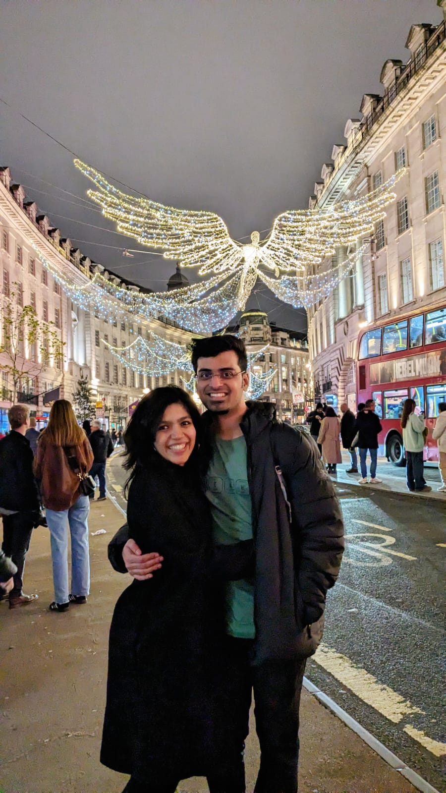 Deepthi and Adith Kiran under the Christmas lights in London